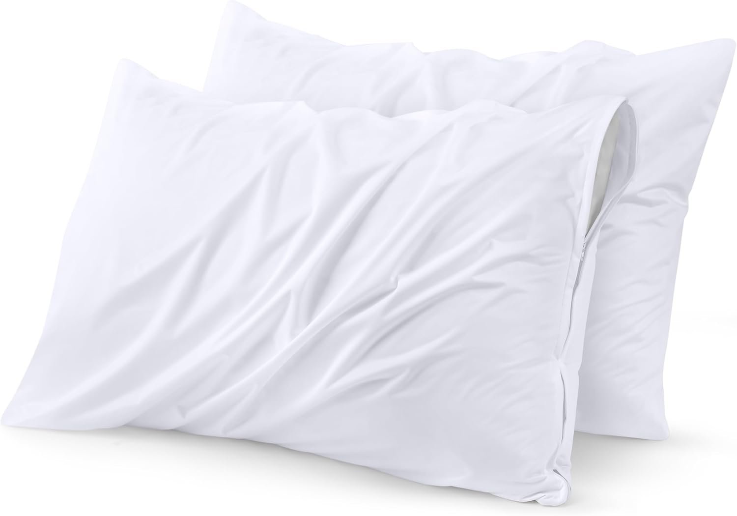 "Two white pillows neatly arranged on a bed, showcasing a crisp, clean appearance and soft texture."