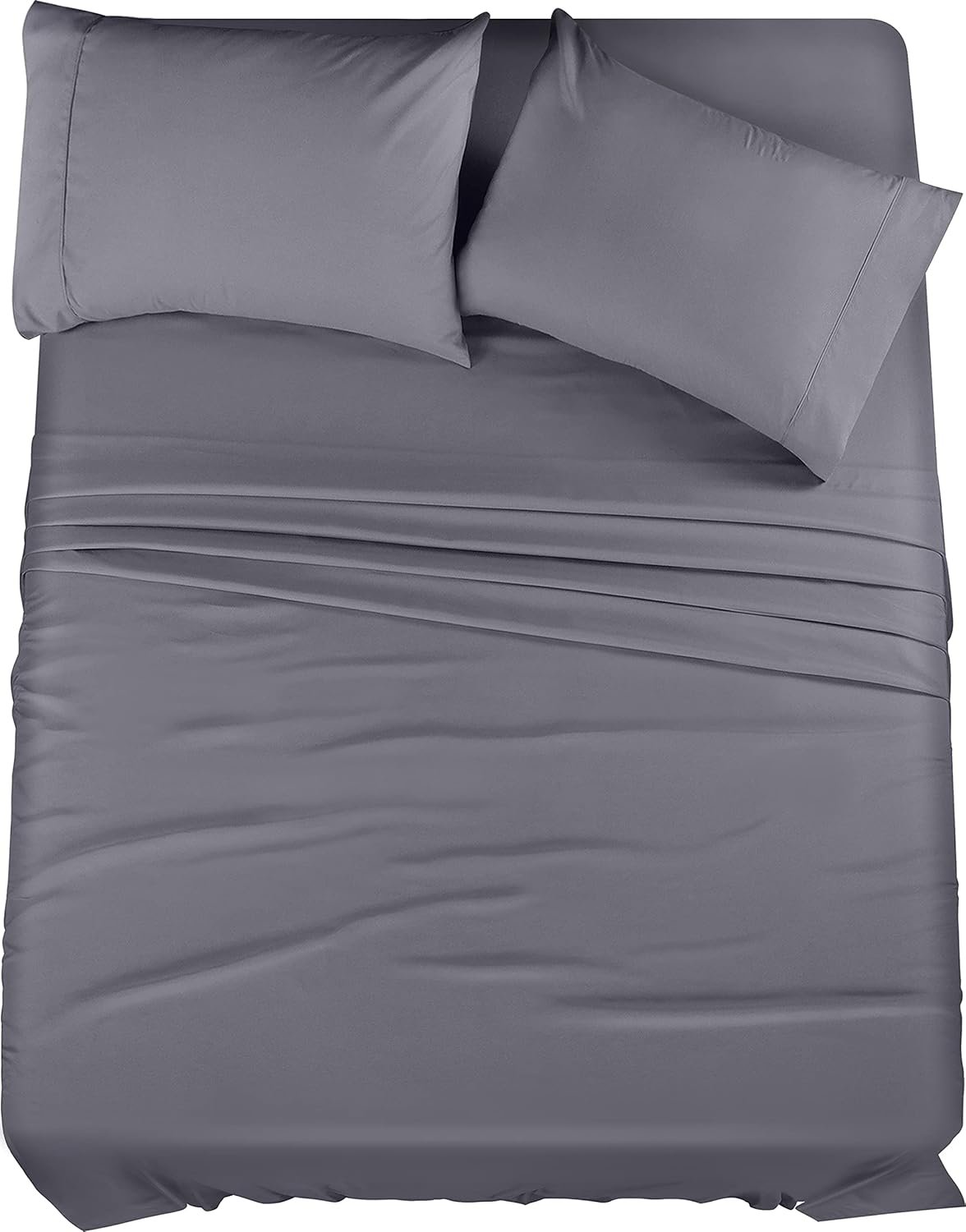 "Set of grey bed sheets, including a fitted sheet, flat sheet, and pillowcases, neatly arranged on a bed. The sheets have a soft, smooth texture and a subtle sheen, adding a sleek and modern touch to the bedding."