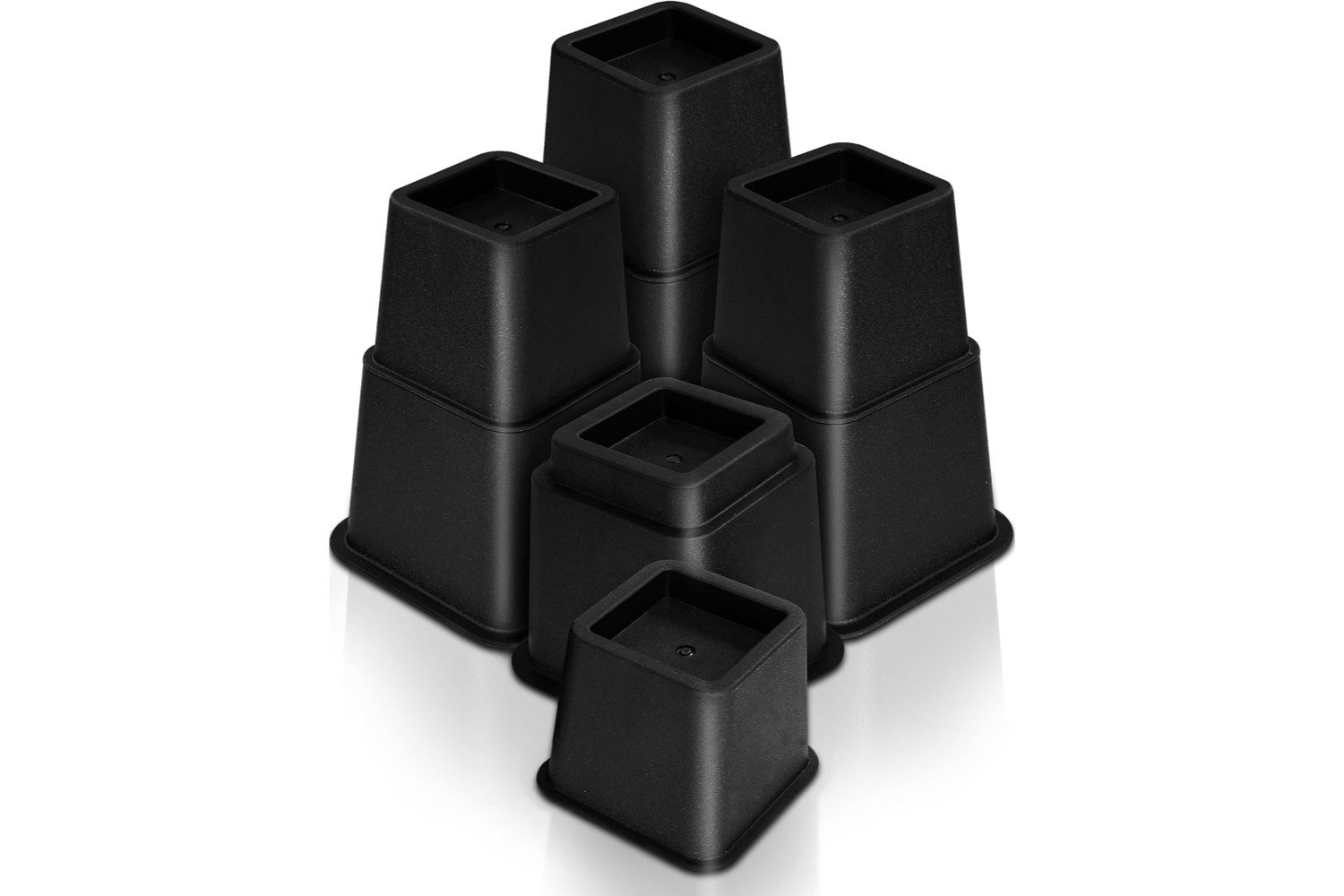 "Bed furniture risers, shown as a set of sturdy, rectangular blocks, designed to elevate a bed frame. The risers are positioned under each bed leg, increasing the height of the bed and providing additional storage space underneath."